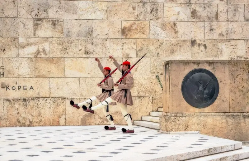 Evzones in traditional uniform during the changing of the guard at the Tomb of the Unknown Soldier